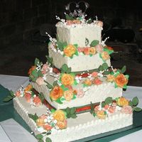 Dscf0312.jpg This was my first wedding cake i made for my own wedding. Flowers are hand made