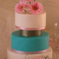 Modern Day Bride We made this cake after seeing one simular on the cover of a Wedding Cake magazine. We think it came out great, and loved the look of it....