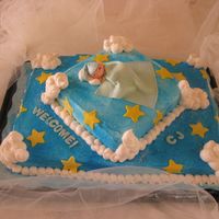 Straight From Heaven Iced in butter cream, clouds made with butter cream and baby was made with fondant.