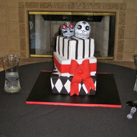 Day Of The Dead Wedding Bride did not want anything traditional. Designed a cake around her day of the dead topper. The topper was too big in my opinion but she...