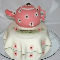 Tea Time! Vanilla cake covered in MMF. Spout, handle, and flowers all gum Paste. Tea Pot made from baking cake in 2 round bowls and then put together...