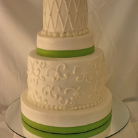 Bridal Shower 4 tier buttercream with lime green ribbon. I loved this cake because of the different heights of each tier. It makes is so much more...