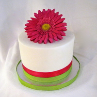 Little Flower Cake This was a very simple cake I did real quick for a friends birthday. Wish I could say I made the flower but I didn't.