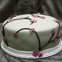 Blossom Cake Birthday cake covered vwith MMF and MMF decorations.