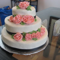 Tiered Cake I need to keep practicing my tiered cakes so that they come out a bit more leveled. It was all made out of buttercream, except for black...