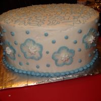 Blue & White Cake Brush embrodiered flowers on the side, cornelli lace on top....all in BC icing.