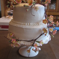 Engagement Party Cake White cake with raspberry swirls. Butter cream and raspberry butter cream fillings and icing. Gum paste cherry blossoms.