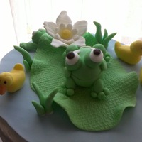 Fondant Frogs And Duckies On Lilly Pad top of a baby shower cake for a baby named Lilly!!