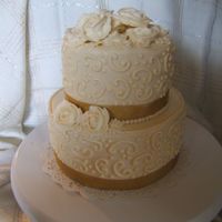 Ivory And Gold Bridal Shower 8inch and 6 inch carrot cake with cream cheese frosting. Roses were a bugger to make with cream cheese frosting