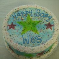 Clouds And Stars This cake was FUN to make! Airbrushed with clouds and stars with colorful sprinkles for a 5 year old! 10 inch WASC buttercream with sugar...