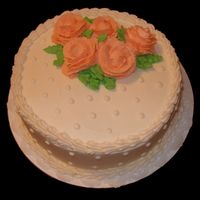 Ivory Bc With Peach Flowers Made this cake after my first Wilton class was completed. Surprised my boss with it for his anniversary with his wife.
