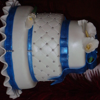 Blue, White And Silver Cake Vanilla cake with vanilla fondant with blue bow and silver accents