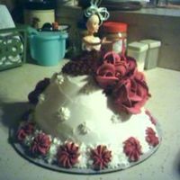 First Doll Cake my first cake that i made as a doll cake, red velvet with butter cream icing and royal icing flowers...