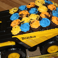 Dump Truck Cupcakes Did these for a little boy turning two. Mom wanted plain cupcakes, but I found a big tonka truck to match the invitation to put them in,...