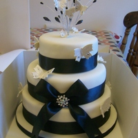 3 Tier Wedding Cake ivory and black wedding cake with butterflies and crystals