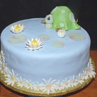 Turtle Cake For One-Year Old Cake for a grandchild of a friend. He loves turtles. The blue is MMF and the lilies and lily pads are gum paste. The cake is 12" x 4&...