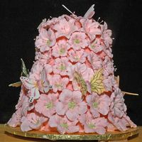 Sweet 16 Cake For My Granddaughter I got inspired by Peggy Porchen's rose tower cake and wanted to try it with royal icing petunias and lilies and butterflies for my...