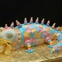 Rainbow Gecko Eating Gumpaste Hibiscus My take on Colette Peter's Mr. Stickey for my granddaughter who has a rainbow gecko.