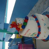 Elmo Meets Baby Einstein First try at a topsy turvy cake and first time with MMF for my 1 yr old's bday. I borrowed the idea from another cc member and let my...