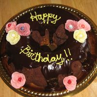 Bundt Cake Tunnel of fudge bundt cake...covered in chocolate ganache. Starburdt roses...I let the jellybeans show too much, but I still like them...at...