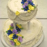 Final Course Iii Cake I loved doing this cake!! I used 12" and 8" heart pans, double-layer on each tier. The flowers are royal icing with fondant...