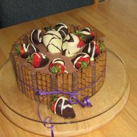 Pirouline Cake Devil's food filled with chocolate mousse (janh recipe). Covered with chocolate BC and dipped strawberries. Finished off with...