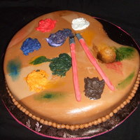 Painter's Pallet Pineapple WASC, cherry bc, and vanilla fondant. Paint brushes are made of fondant and the paint is bc.
