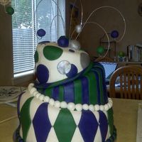 My First Cake This was the first tiered cake as well as the first fondant cake I had ever made...I was feeling brave! The cakes are vanilla and lemon...