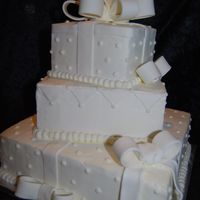 Square Wedding Cake 3 tiered, stacked, staggered, square wedding cake done in butter cream.