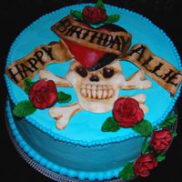 Ed Hardy Cake Ed Hardy design and roses are done in MMF. Cake is frosted in B/C.Designed after Ed Hardy's "Love Kills Slowly"