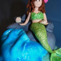 Upclose View Of Mermaid This mermaid was at the top of my daughter's birthday cake. I made it to look like her. It is fashioned after Debbie Brown's...