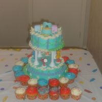 Sesame Str. Baby Shower Cake my first attempt at using my colums. Buttercream icing butter cake. make the crib and baby from gumpaste. extra batter....made cupcakes!...