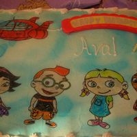 Little Einsteins Rocket, & Little Einsteins drawn on wafer paper and filled in with colored piping gel. "Happy Birthday" sign lit up and...