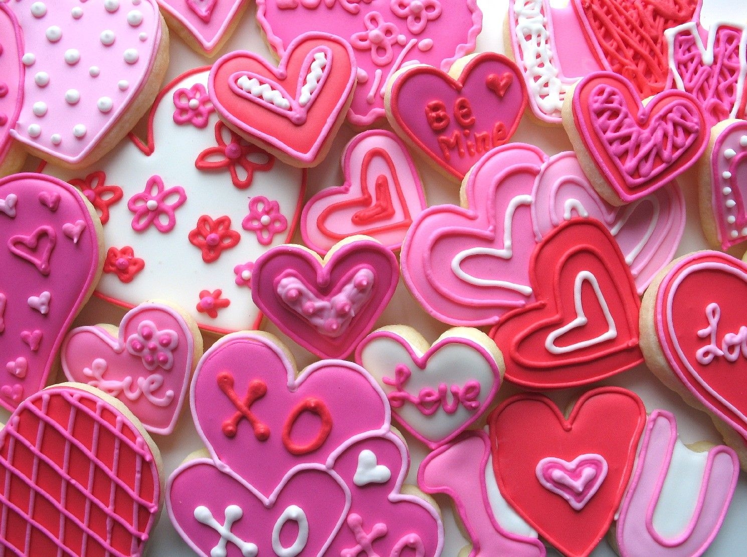 Valentine's Cookies These are valentine's day sugar cookies decorated with pink and red royal icing.