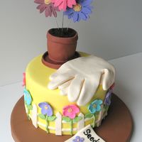 Garden Flowers This cake was inspired by a cake on Wilton's website. Three large gumpaste flowers on wires and all of the other decorations are mmf....