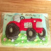 International Tractor Cake Sheet cake with Wilton' tractor cake pan. Fondant bees and flowers