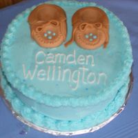 Moccasin Baby Shower Cake This is a cake I made for my nephew's baby shower. I made the tiny moccasins out of fondant. Thanks for looking!