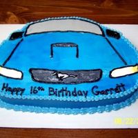 Garrett's Mustang My son's 16th birthday cake. He got a Mustang for his b/day so I made his cake to match. Carved from an oval cake, decorated in...