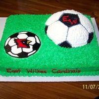 East High Soccer Cake for my son's end of season soccer party. 11 x 15 cake w/FBCT and 1/2 of the Wilton sports ball. Cake covered in b/c "grass&...