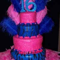 Sweet 16 4 tiers, alternating vanilla & chocolate cake, covered in buttercream, then MMF, with zebra stripes & edible glitter