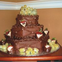 Groom's Cake 3 tier hexagon with strawberries dressed in tux and grapes