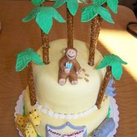 Curious George This cake was for my son's 2nd birthday. It's based off his favorite book: Curious George feeds the animals. MMF with pretzel rod...