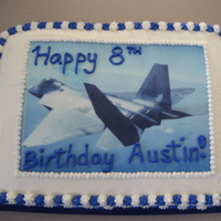 F-22 Raptor Cake This is a root beer flavored cake with vanilla buttercream. The picture is an edible image of a F-22 Raptor that my son requested.