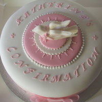 Confirmation Chocolate cake with chocolate buttercream filling. Covered in fondant. Gumpaste Figure