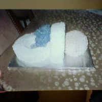 Baby Binky baby shower cake i made for a friend. saw picture in a magazine and loved it, cake was made from a ball pan and two 10" round cake,...