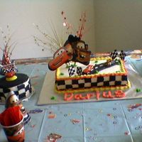 Birthday another view of the cake with a small smash cake on the side.