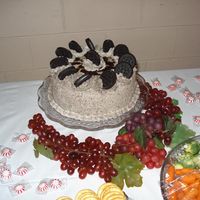 Oreo Groom's Cake Buttercream icing with crushed up Oreos mixed it, topped with oreos, and drizzled with chocolate syrup. I was called the night before...