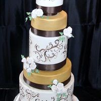 Gold Column Cake Annie's Culinary Creations serves the Dallas Fort Worth metroplex with custom wedding and party cakes. This cake features double...
