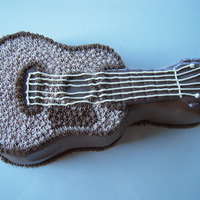 Guitar Cake Guitar cake using Wilton cake pan. Chocolate cake with peanut butter buttercream. Melted chocolate accents.