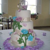 First Wedding Cake Inspired by Peggy Porshen... gumpaste flowers, chocolate cake covered in fondant.